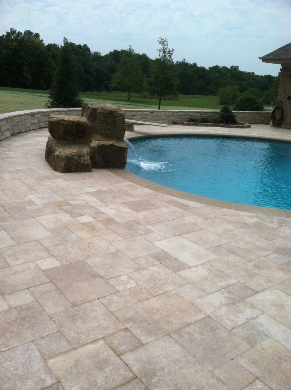 Travertine pavers around pool